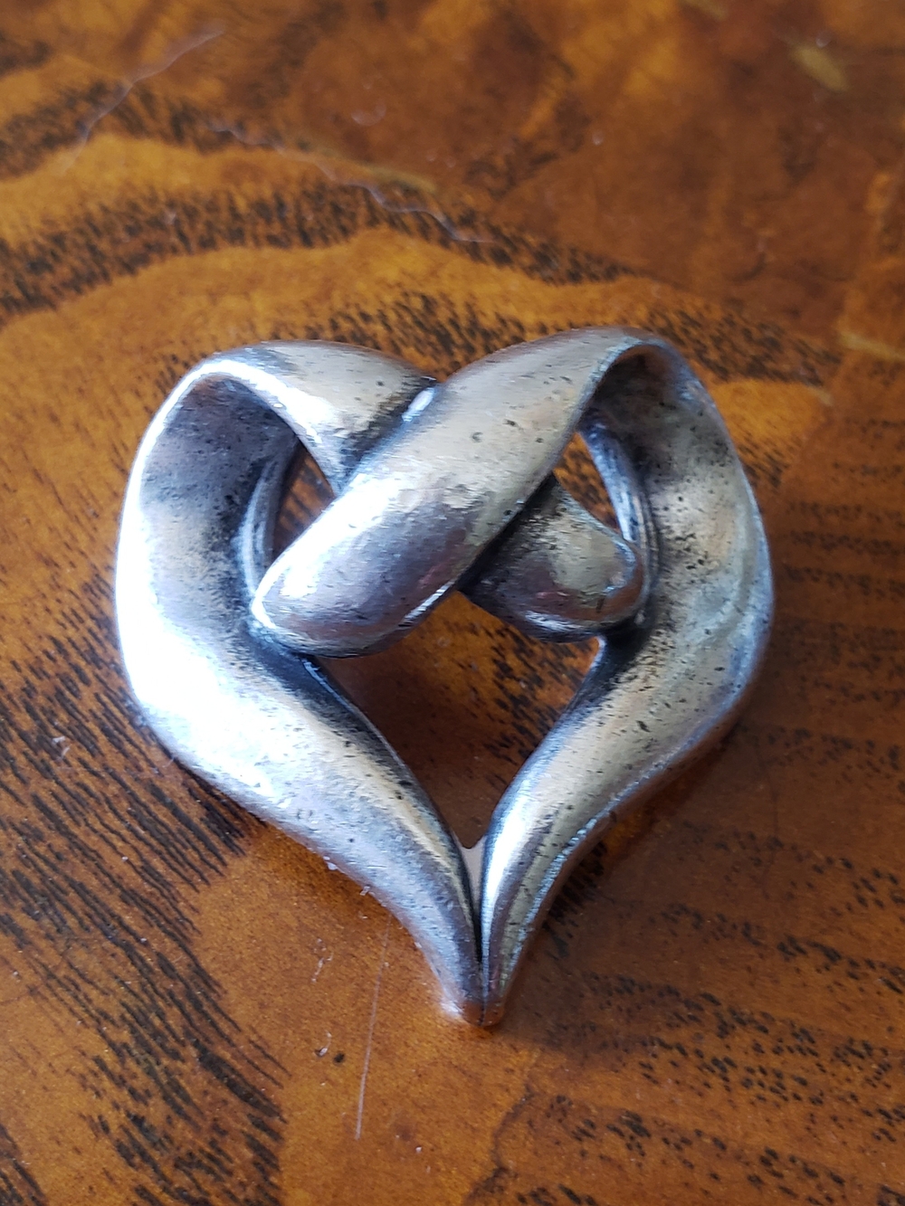 Silver Lovers Knot  Sculpted Heart With Twisted Design Pendant